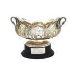 A silver twin-handled trophy bowl, of shaped oval form, with semi-spiral fluted,