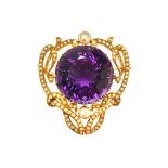 A gold, amethyst and seed pearl pendant brooch, in a scroll pierced openwork design,