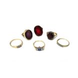 A gold and platinum, garnet and diamond set oval cluster ring,