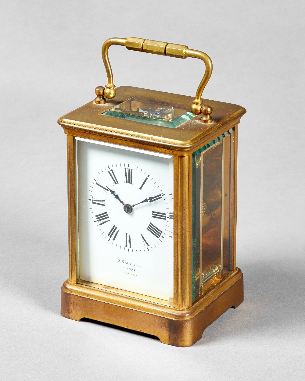 A French gilt brass carriage timepiece Circa 1900 In a Corniche case with bevelled glass panels,