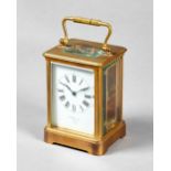 A French gilt brass carriage timepiece Circa 1900 In a Corniche case with bevelled glass panels,