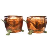 A pair of hand hammered copper and brass coal buckets of circular form,