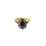 A gold, ruby and diamond set nine stone oval cluster ring,