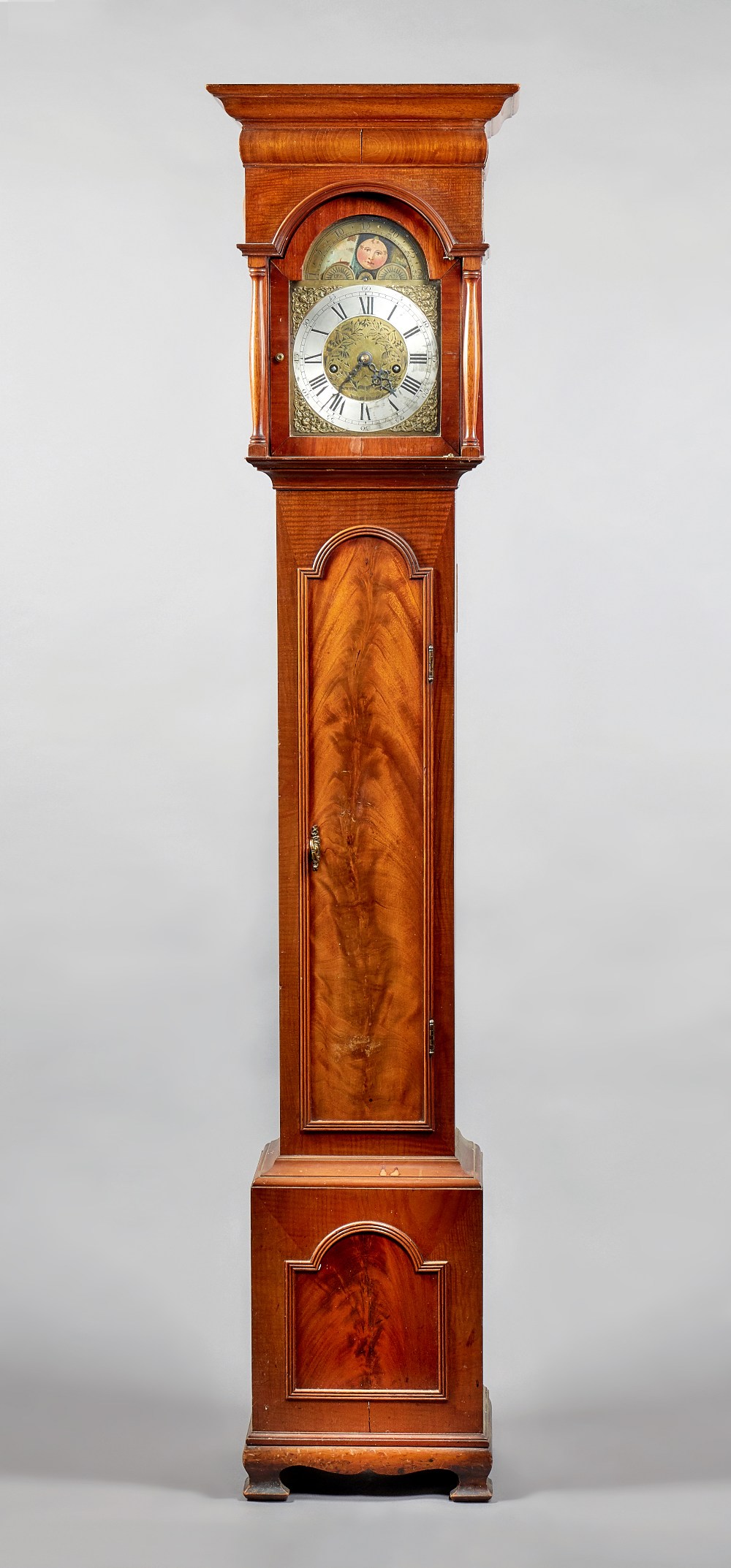 A mahogany longcase clock of small size, Circa 1930 The hood with a stepped rectangular pediment,