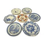 A Chinese famille-rose plate, Qianlong, painted with a central vase, bowl of fruit and flowers,