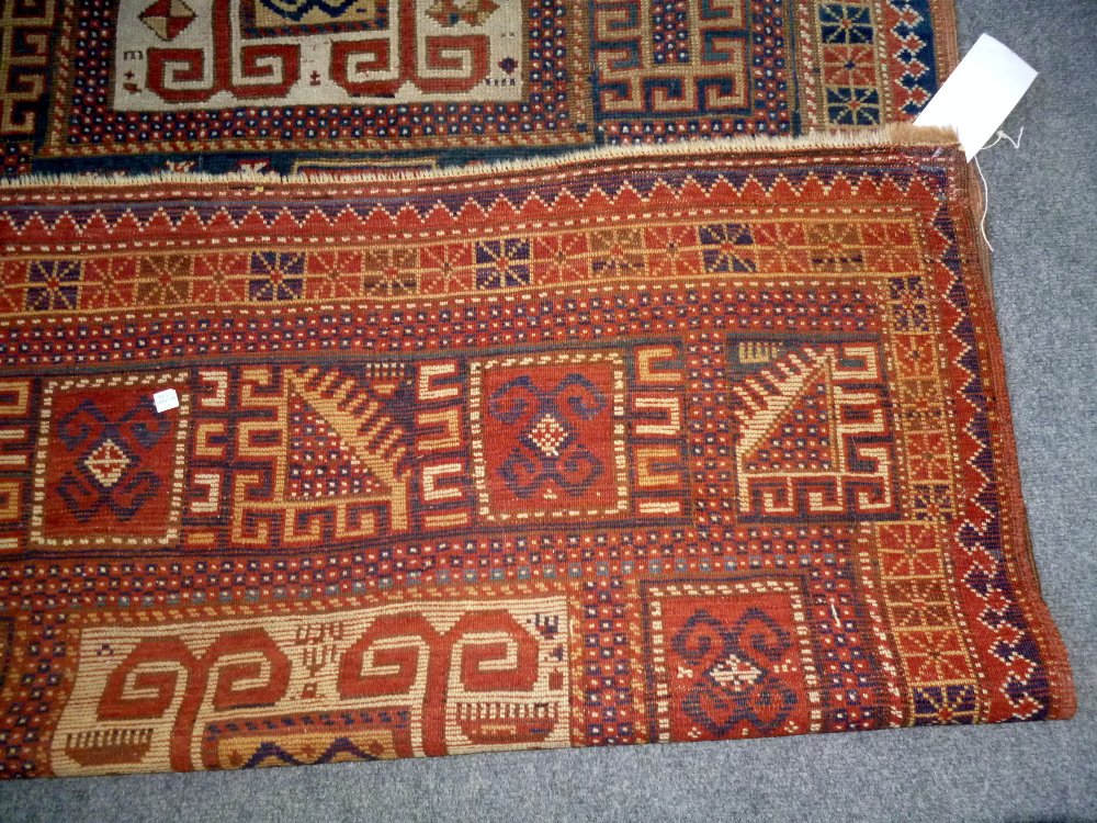 A Karachor Kazak rug, Caucasian, the indigo field with two ivory squares, a madder central cross, - Image 5 of 11