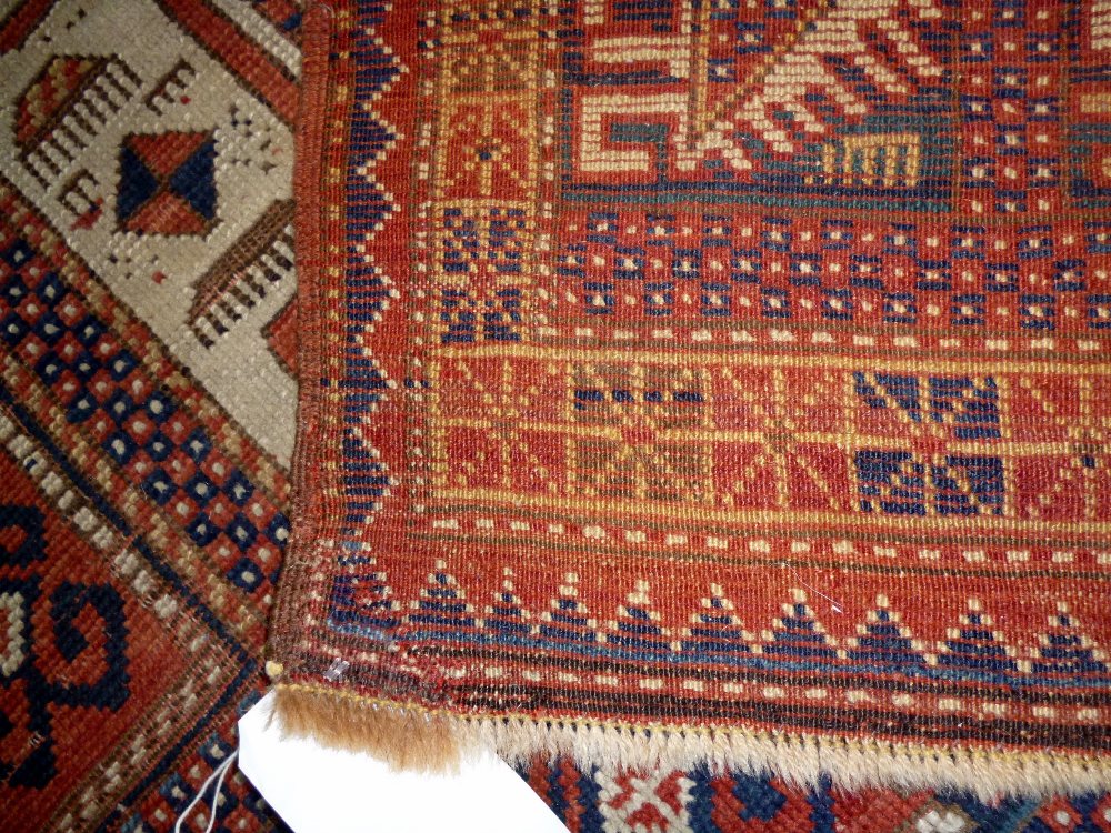 A Karachor Kazak rug, Caucasian, the indigo field with two ivory squares, a madder central cross, - Image 2 of 11