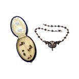 A Bohemian garnet set necklace, the front in a pierced openwork design,