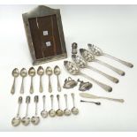 Mostly silver, comprising; a set of four berry fruit serving spoons, crest engraved, London 1823,
