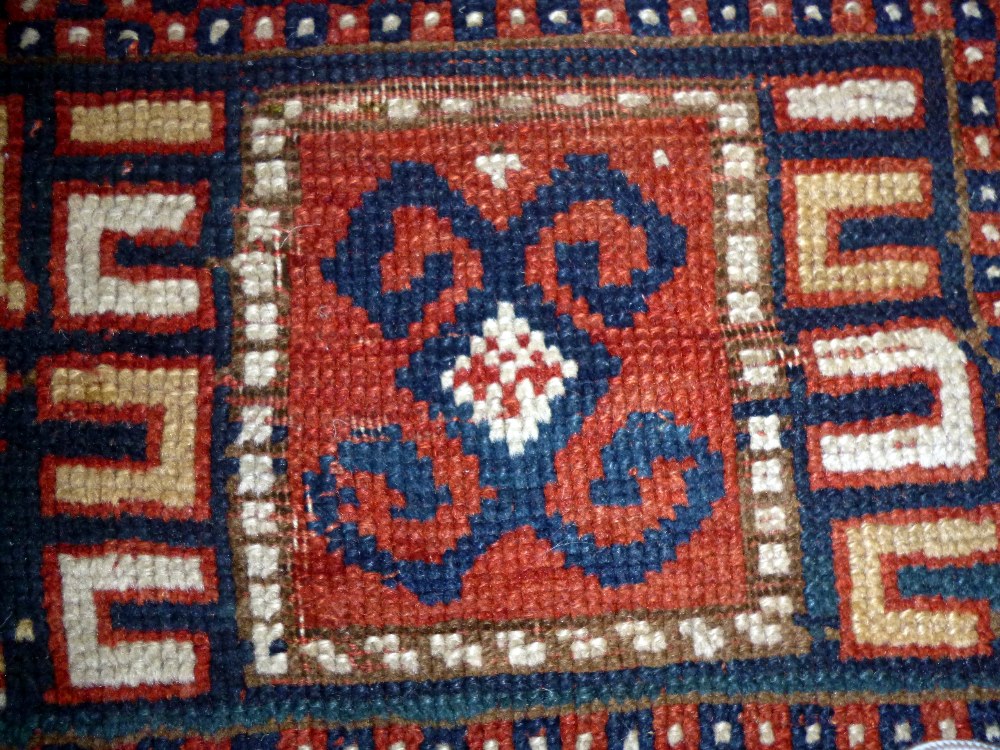 A Karachor Kazak rug, Caucasian, the indigo field with two ivory squares, a madder central cross, - Image 7 of 11