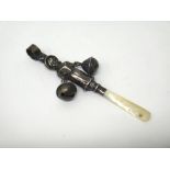 A silver and mother of pearl baby's rattle,