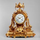 A French ormolu mantel clock In the Louis XVI style,