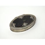 An 18th century silver mounted oval hinge lidded snuff box, gilt within,