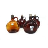 A set of three amber glass flagons, late 19th century, each with an engraved silver plated mount,