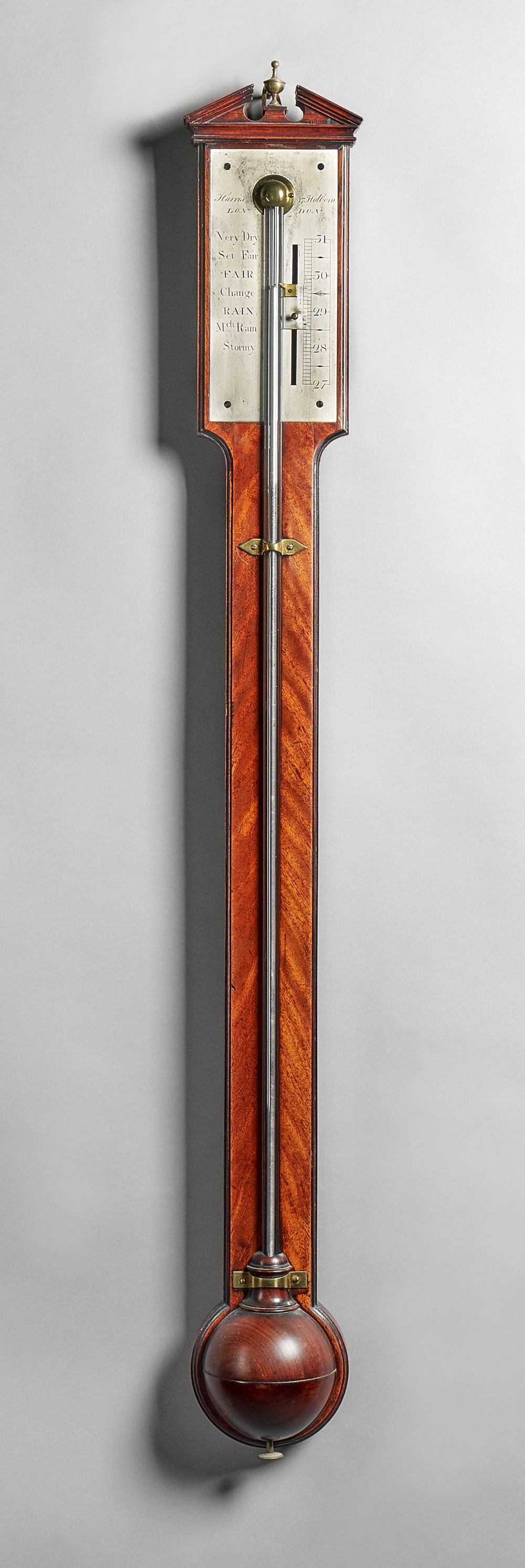 A George III mahogany stick barometer By Harris,