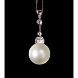 An 18ct white gold, cultured pearl and diamond pendant,