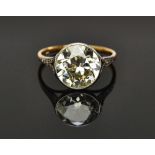 A gold and diamond solitaire ring,