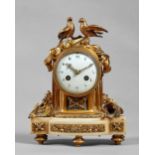 A French ormolu and white marble mantel clock In the Louis XVI style,