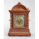 A German oak cased chain fusée three train quarter-chiming and repeating bracket clock By