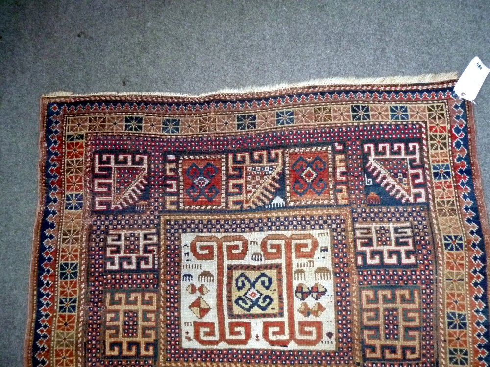 A Karachor Kazak rug, Caucasian, the indigo field with two ivory squares, a madder central cross, - Image 4 of 11