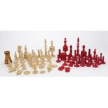 A turned and carved ivory chess set, 19t