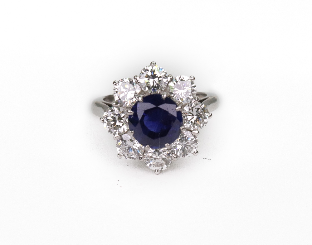 A modern sapphire and diamond cluster ri