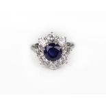 A modern sapphire and diamond cluster ri