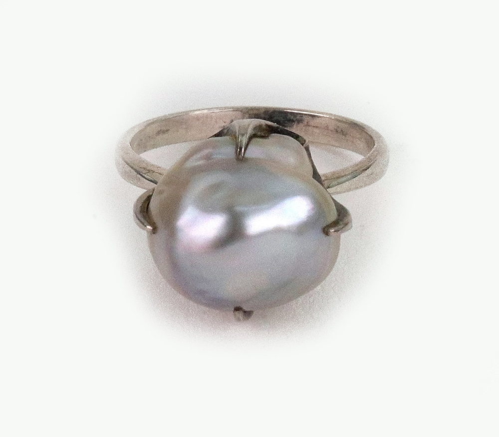 A baroque pearl ring, the slightly grey