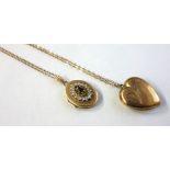 A 9ct gold oval locket, set with a dark