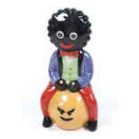 A Carlton Ware trial figure "Golliwogg on a space hopper",