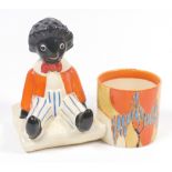 A Clarice Cliff Golliwogg pencil pot,