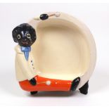 A Clarice Cliff baby bowl, the rim moulded with a Golliwogg with drumsticks, 21 x 20cm,