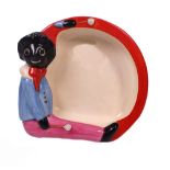 A Clarice Cliff Bizarre baby bowl, the rim moulded with a Golliwogg with drumsticks, printed marks,