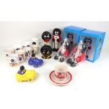 A pottery Golliwogg head money box, 12cm, a pottery standing figure money box, 19cm,