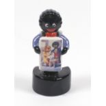 A Carlton Ware sample figure 'Golliwogg sandwich board', 10cm, printed marks,