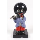 A Carlton Ware figure Golliwogg flautist, probably after a design by Francis Joseph,