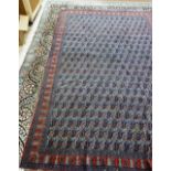 A West Persian carpet, with repeat botch field and narrow red ground boteh border, 212cm x 317cm.