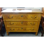 A Louis XVI style three drawer commode, on tapering square supports,