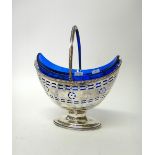 A George III silver sugar basket, of oval form, with pierced and engraved decoration,