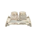 A Victorian silver rectangular twin bottle inkstand, with engraved decoration within beaded rims,