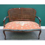 A Louis XV style stained beech open arm sofa, with serpentine seat and cabriole supports,