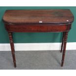 A Regency mahogany card table, the 'D' shaped top on turned supports,