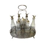 A Danish seven bottle cruet stand of wirework form,