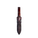 A Maori 'Taiaha', 19th century (lacking shaft), the spear form head with symmetrical carving,