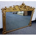 A Victorian gilt framed rectangular overmantel mirror with bold carved acanthus decoration,