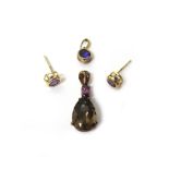 A 9ct gold, smoky quartz and rhodolite garnet set two stone pendant,