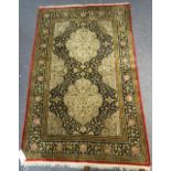 An Indian part silk rug,