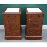 A pair of satin birch four drawer pedestals, each with marble inset top, on plinth base,