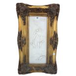 A modern faux marble plaque relief carved with a classical maiden and cherub attendants, incised 'F.