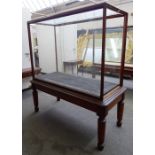 A large glazed mahogany framed free-standing museum display cabinet,